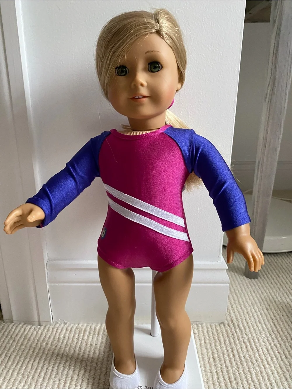 American Girl Isabelle doll with three outfits, ballet bar and two stands.